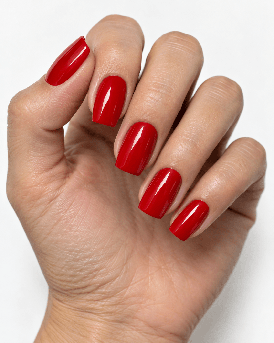Hand with classic cherry-red glossy square acrylic nails.