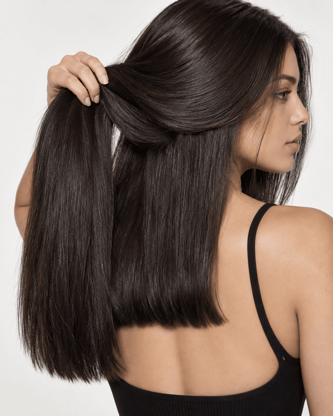 Long thick hair with a blunt outer edge and internal layers removing bulk.