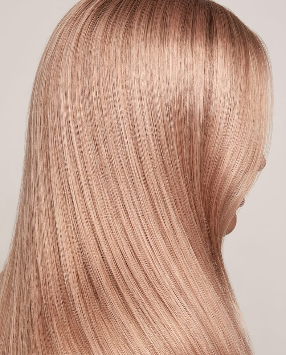 Woman with blonde hair featuring a subtle rose gold undertone